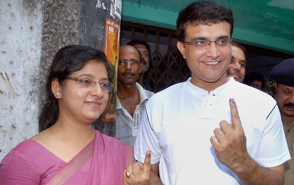 Sourav Ganguly and his wife Dona Ganguly show their marked fingers after casting their votes for the last phase of Lok Sabha elections in Kolkata.