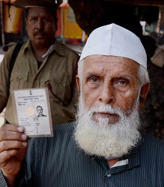 A Muslim voter showing his voter ID card at a polling booth in North 24 Parganas in West Bengal.