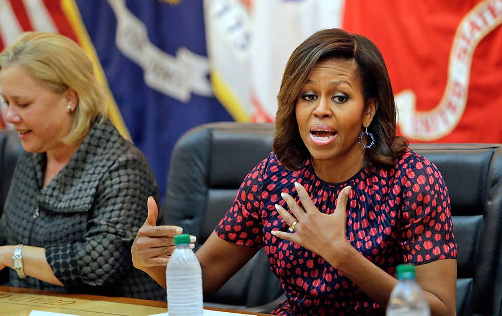 First lady Michelle Obama and Sen. Mary Landrieu, left, D-La., meet with spouses of Veterans at the National World War II Museum in New Orleans.