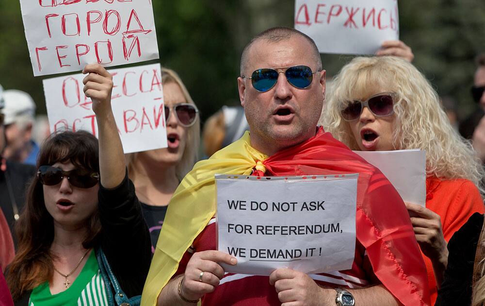 Pro-Russian people shout slogans supporting the referendums in eastern Ukraine and demanding a similar action for their town in Odessa, Ukraine, during a protest joined by hundreds. 