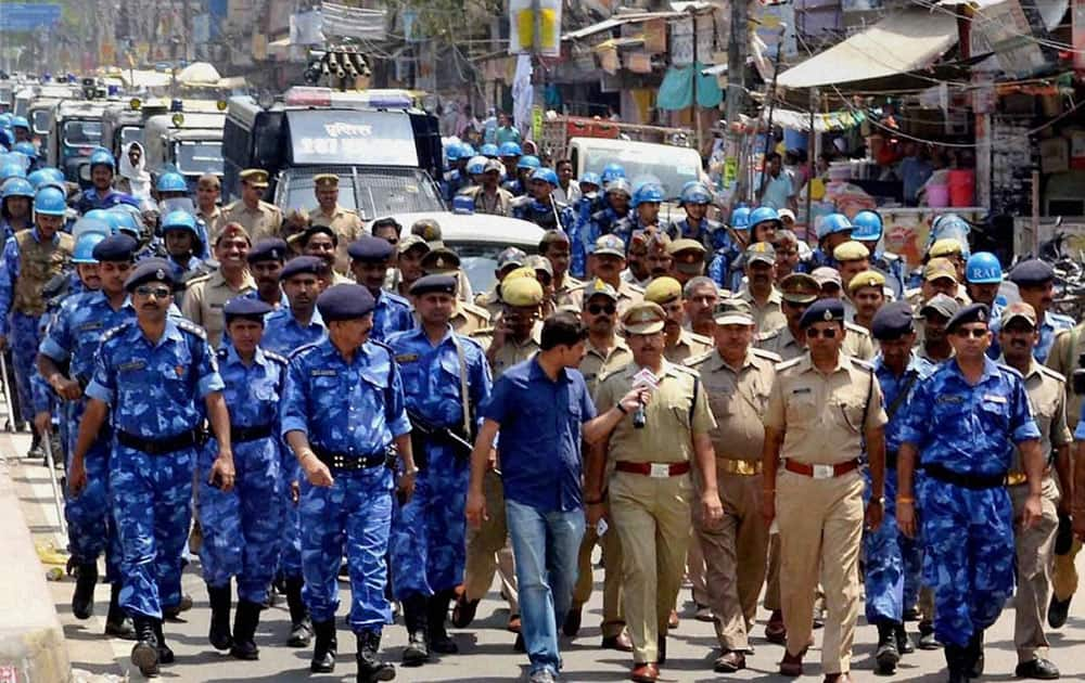 Security personnel conduct flag march ahead of the last phase of Lok Sabha elections in Varanasi.