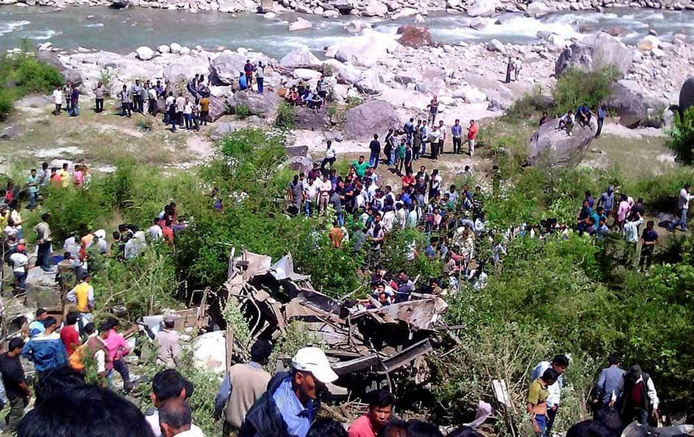 Rescue work is carried out after a bus fell into River Mandakini in Chamoli district.