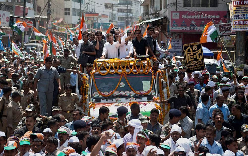 Congress Vice President Rahul Gandhi waves during road show for party candidate Ajay Rai in Varanasi.