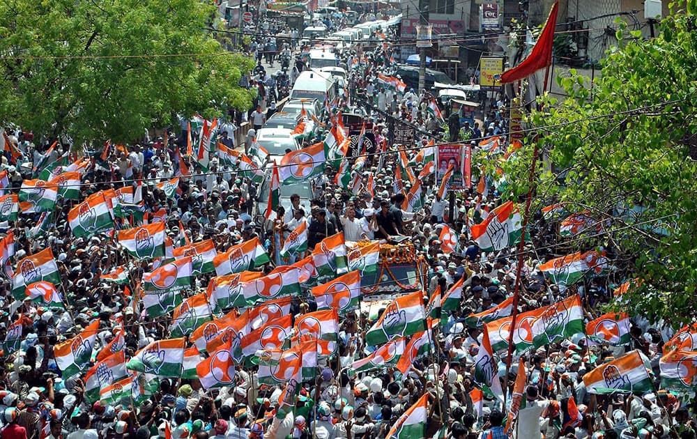 Supporters during Congress Vice President Rahul Gandhi`s road show for party candidate Ajay Rai in Varanasi.