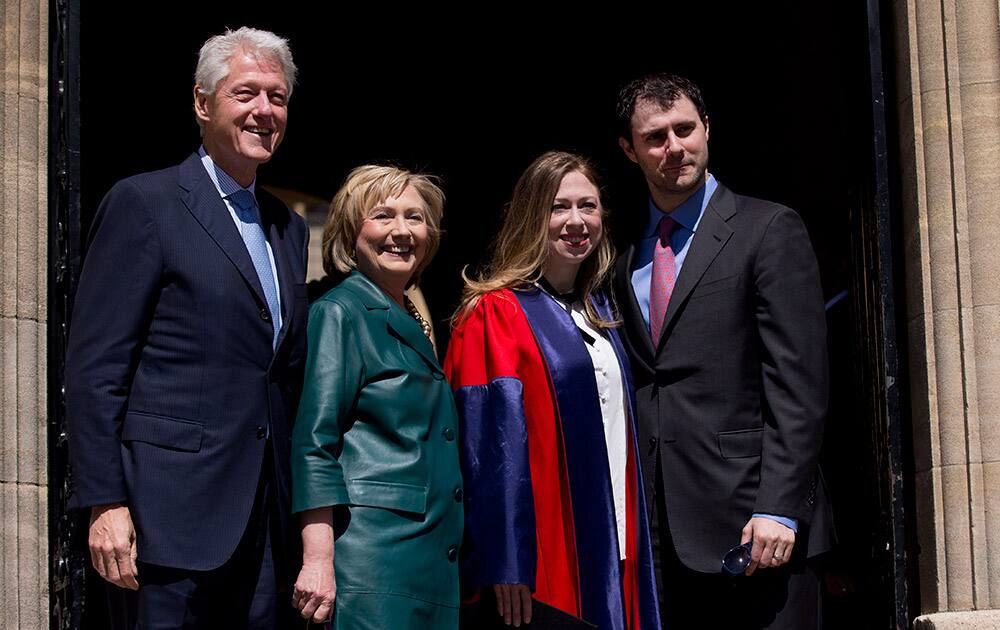 Former US President Bill Clinton and his wife former Secretary of State Hillary Rodham Clinton, second left, pose for photographers with their daughter Chelsea, second right, and her husband Marc Mezvinsky, after they all attended Chelsea`s Oxford University graduation ceremony at the Sheldonian Theatre in Oxford, England.