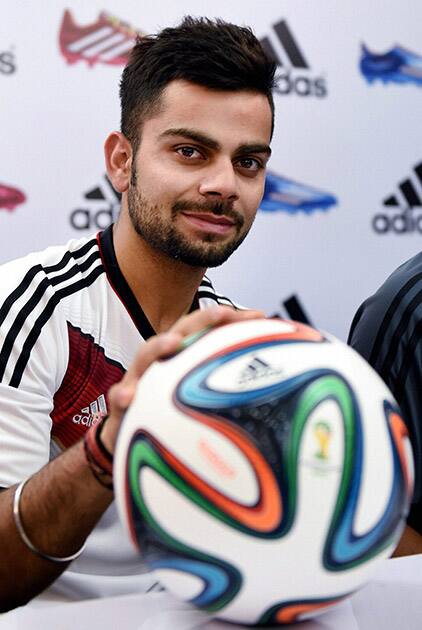 RCB cricketer Virat Kohli looks on during an event of FIFA Flag Bearers 2014 in Bengaluru.