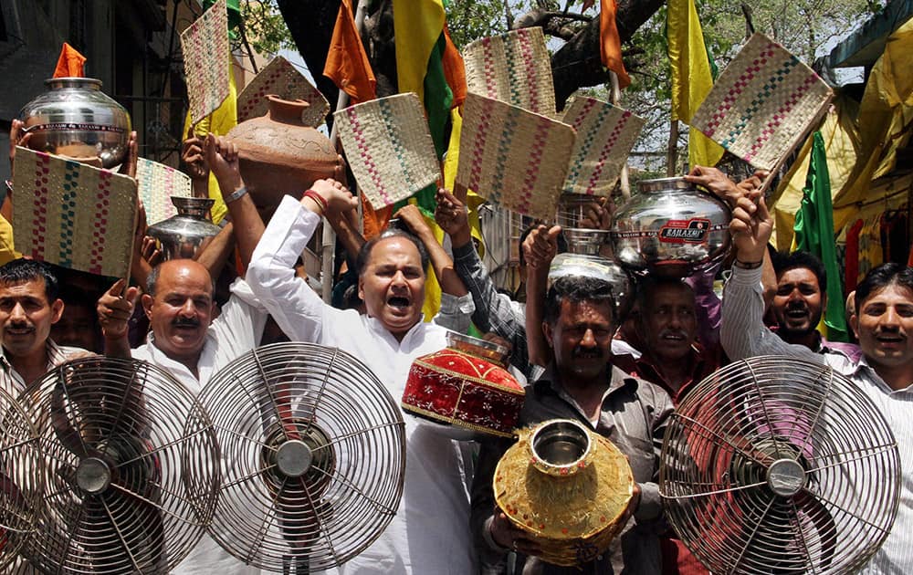 Activists of Shiv Sena and Dogra Front shout slogans during a protest against the water and electricity crises in Jammu.