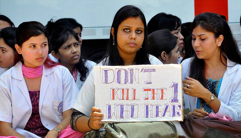 Junior doctors of Guwahati Medical College Hospital protest against the killing of a post graduate medical student of Dibrugarh`s Assam Medical College Hospital (AMCH), in Guwahati,