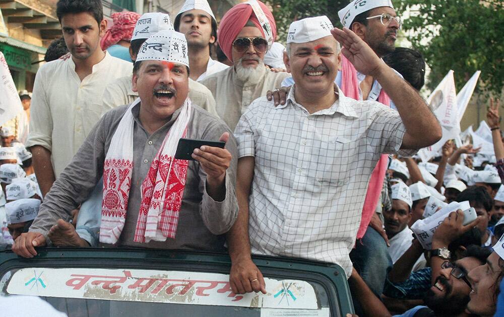 AAP leaders Sanjay Singh and Manish Sisodiya during party convener Arvind Kejriwal`s election road show in Varanasi.