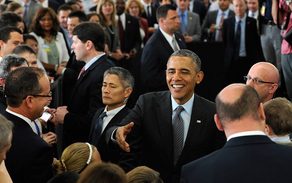 President Barack Obama greets the crowd after speaking about energy at a Walmart in Mountain View, Calif.