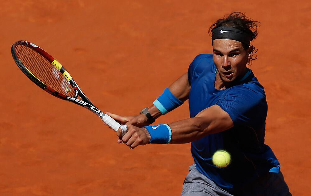 Rafael Nadal from Spain returns the ball during a Madrid Open tennis tournament match against Tomas Berdych from Czech Republic in Madrid.