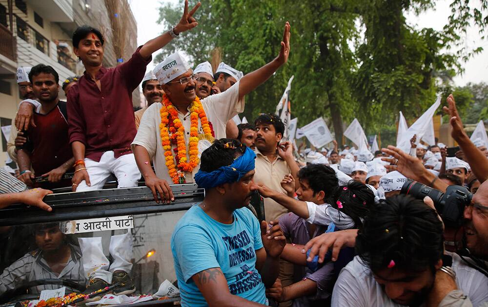 Aam Aadmi Party (AAP), or the common man party, chief Arvind Kejriwal waves at supporters during an election campaign rally in Varanasi, in the northern Indian state of Uttar Pradesh.