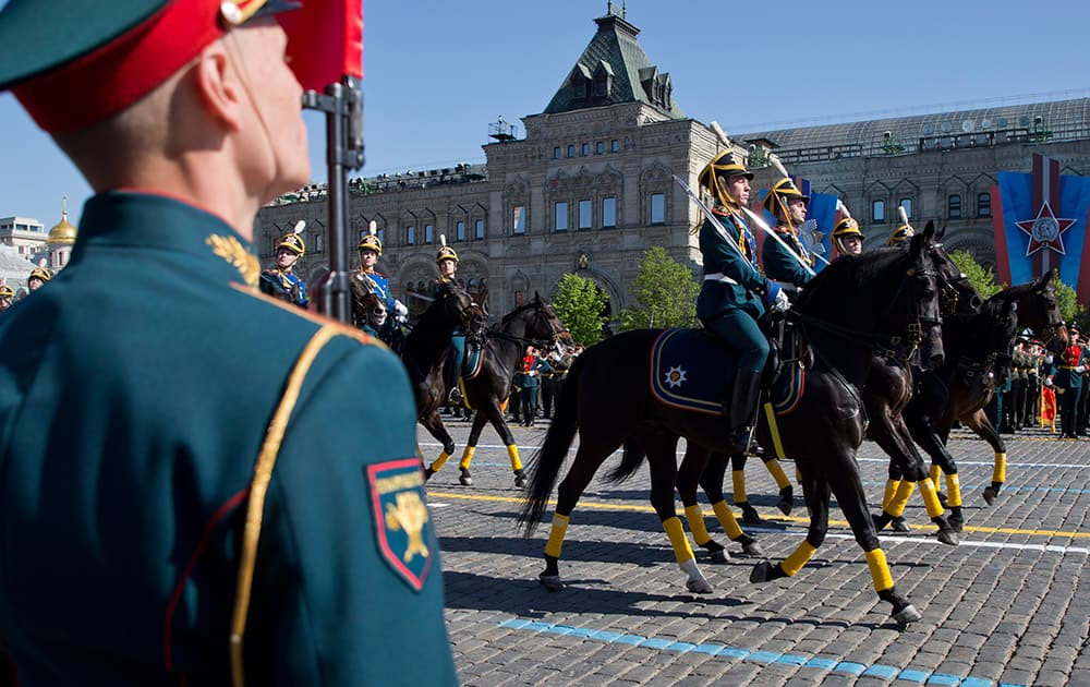 Russian soldiers rides horses during the Victory Day Parade, which commemorates the 1945 defeat of Nazi Germany in Moscow, Russia.