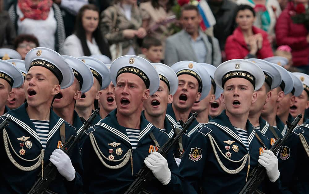 Russian Black Sea fleet sailors salute during the Victory Day military parade, which commemorates the 1945 defeat of Nazi Germany, in Sevastopol, Russia.