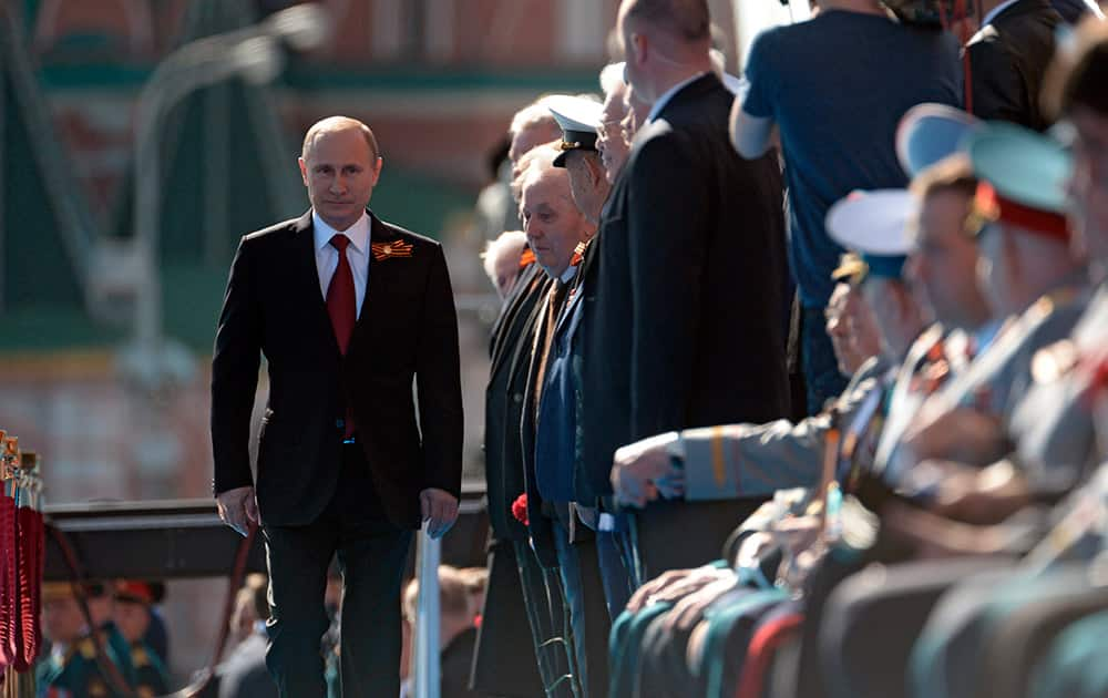 Russian President Vladimir Putin arrives to attend a Victory Day parade, which commemorates the 1945 defeat of Nazi Germany, in Moscow, Russia.