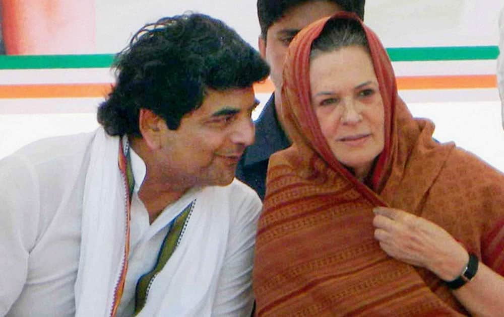 Congress President Sonia Gandhi with party leader RPN Singh during an election campaign at Padrauna in Kushinagar.