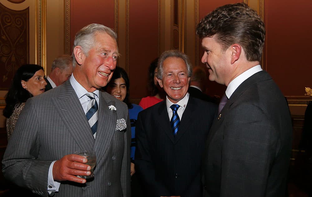 Britain`s Prince Charles, Honorary Patron, Association of Marshall Scholars, left, meets Matthew W. Barzun, Ambassador of the United States of America to the United Kingdom, right, at a reception to celebrate the 60th Anniversary of The Marshall Scholarships at the Foreign and Commonwealth Office, in London.