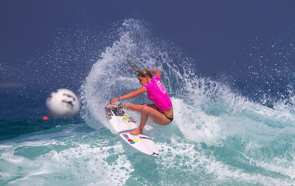 This photo provided by the Association of Surfing Professionals (ASP), Lakey Peterson, of the United States, cuts back on a wave during her round 3 heat in the Billabong Rio Pro surfing competition, in Rio de Janeiro, Brazil.