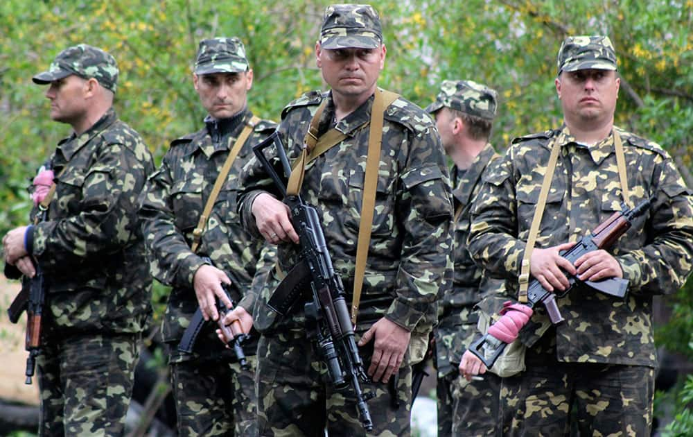 Ukrainian government troops guard an administration building in Mariupol, eastern Ukraine.