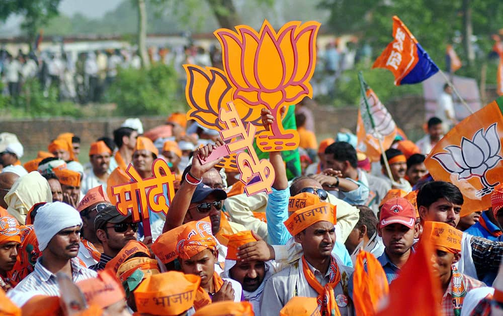 Supporters during BJP PM candidate Narendra Modi`s election road show in Varanasi.