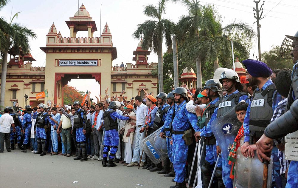 RAF personnel guard during BJP PM candidate Narendra Modi`s election road show in Varanasi.