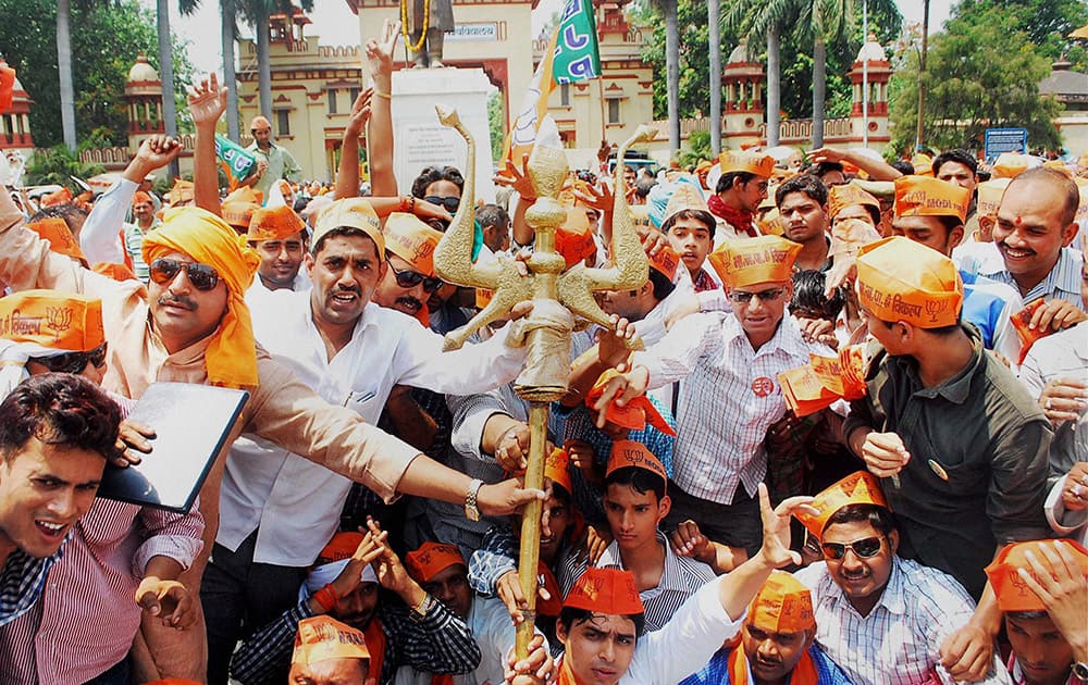 BJP activists stage a protest dharna against the Election Commission near the BHU at Lanka in Varanasi.