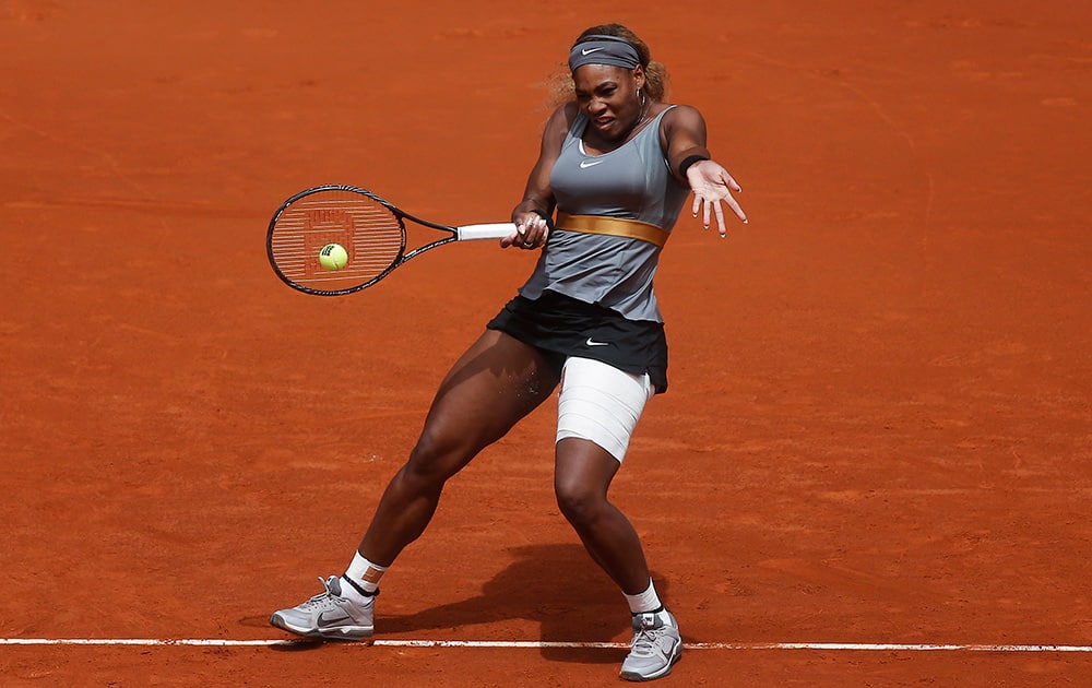 Serena Williams from US returns the ball to Shuai Peng from China during a Madrid Open tennis tournament match in Madrid, Spain.