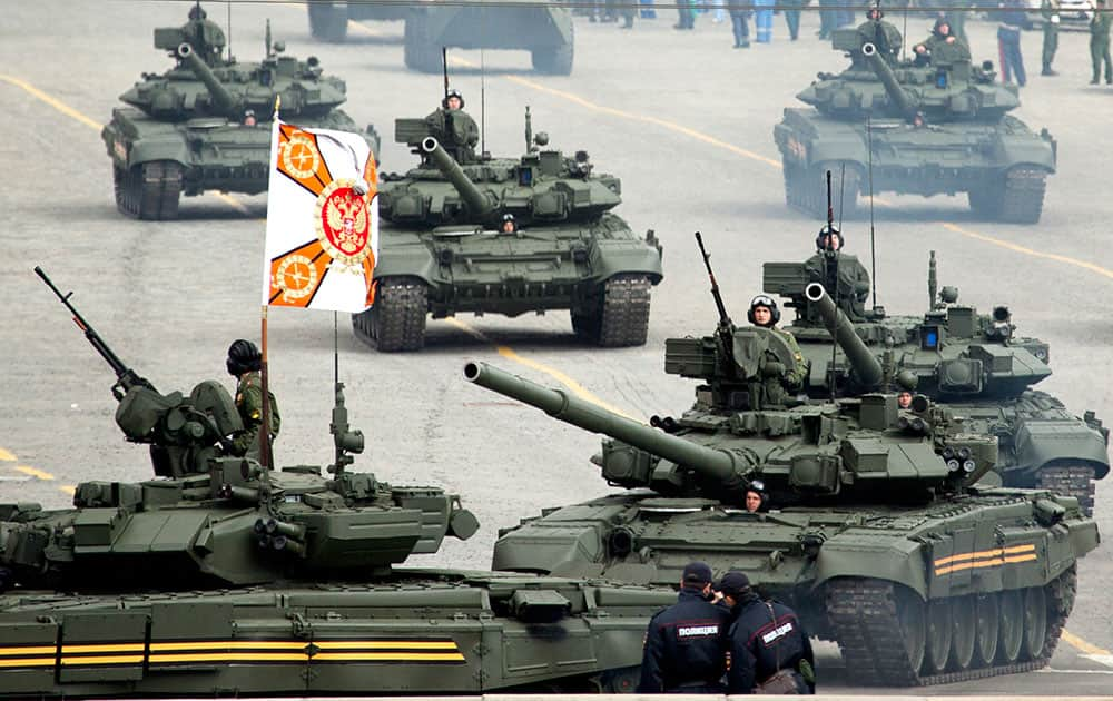 Russia tanks T-90A make their way through the Red Square during a rehearsal for the Victory Day military parade, slated for May 9 at at the Red Square to celebrate 69 years of the victory in WWII, in Moscow.