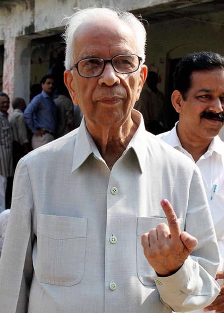 BJP senior leader Kesari Nath Tripathi shows his ink marked finger after casting vote for 8th phase of Lok Sabha Election in Phulpur.