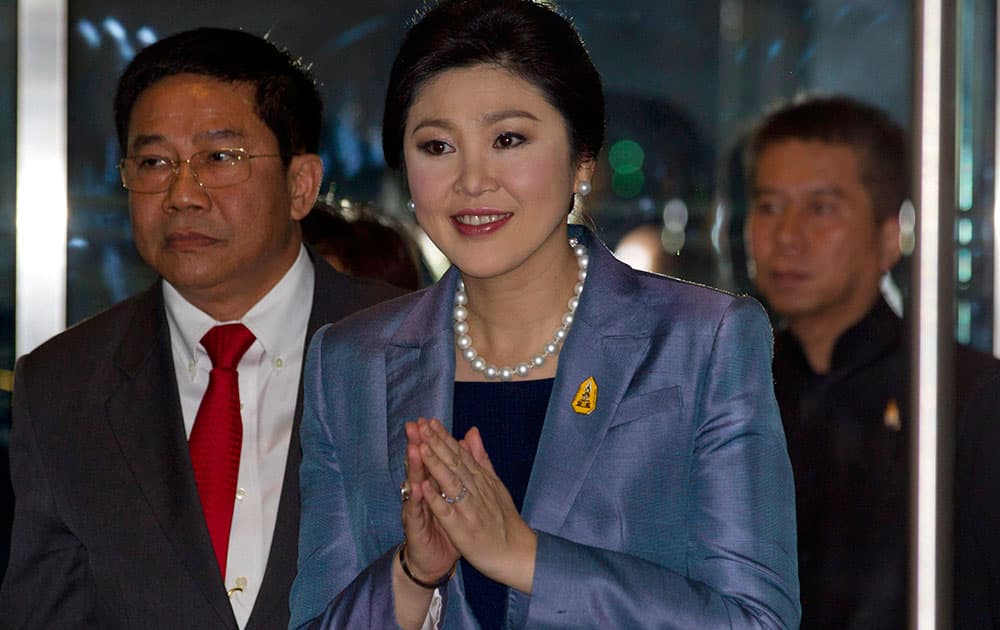 Thailand`s Prime Minister Yingluck Shinawatra arrives at the Constitutional Court in Bangkok.