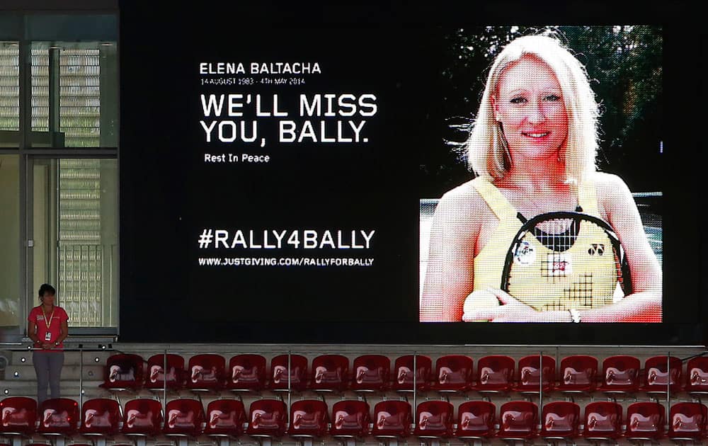 An image of Elena Baltacha is displayed in the stadium as people stand for a minute of silence for Baltacha before a Madrid Open tennis tournament match between Yvonne Meusburger from Austria and Carla Suarez Navarro from Spain in Madrid.