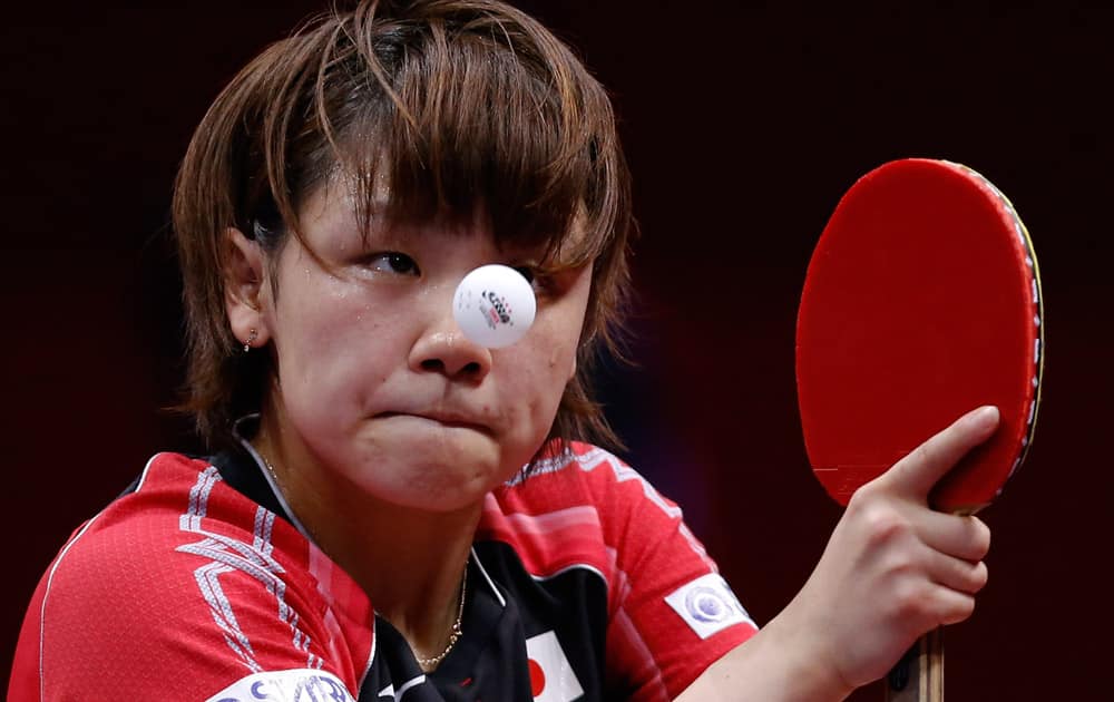 Yuka Ishigaki of Japan serves against Lee Ho Ching of Hong Kong during their semifinal match of the World Team Table Tennis Championships in Tokyo