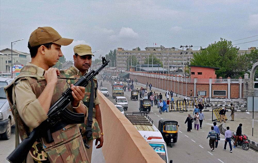 Security personnel stand guard outside the civil secretariat complex on the first day of bi-annual Darbar move to Srinagar.