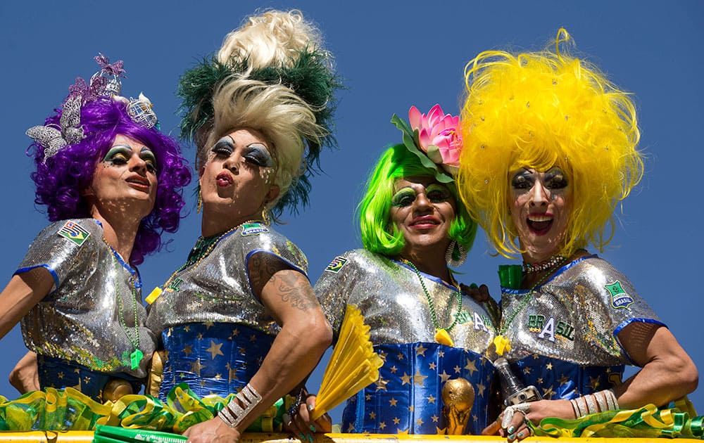 Revelers pose for photos during the annual Gay Pride Parade in Sao Paulo, Brazil.