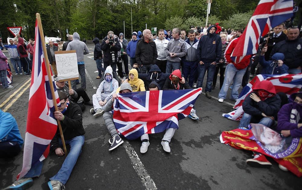 Loyalist protesters form a sit down protest outside Antrim Police Station, Northern Ireland.