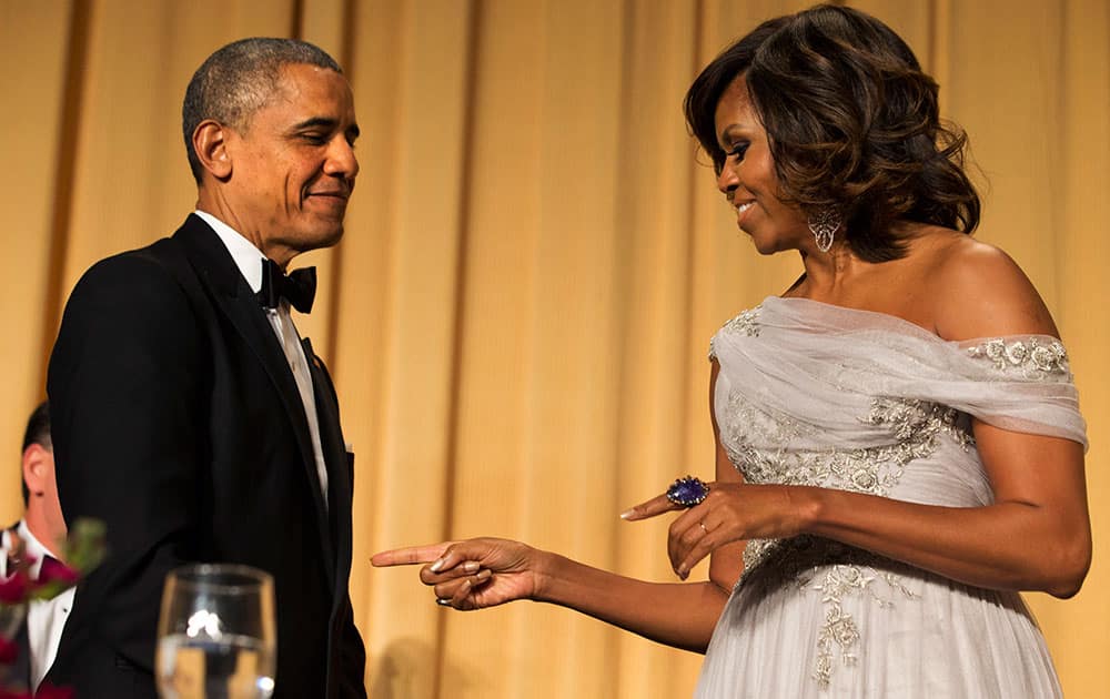 First lady Michelle Obama, left, jokes with President Barack Obama, during the White House Correspondents` Association (WHCA) Dinner at the Washington Hilton Hotel.