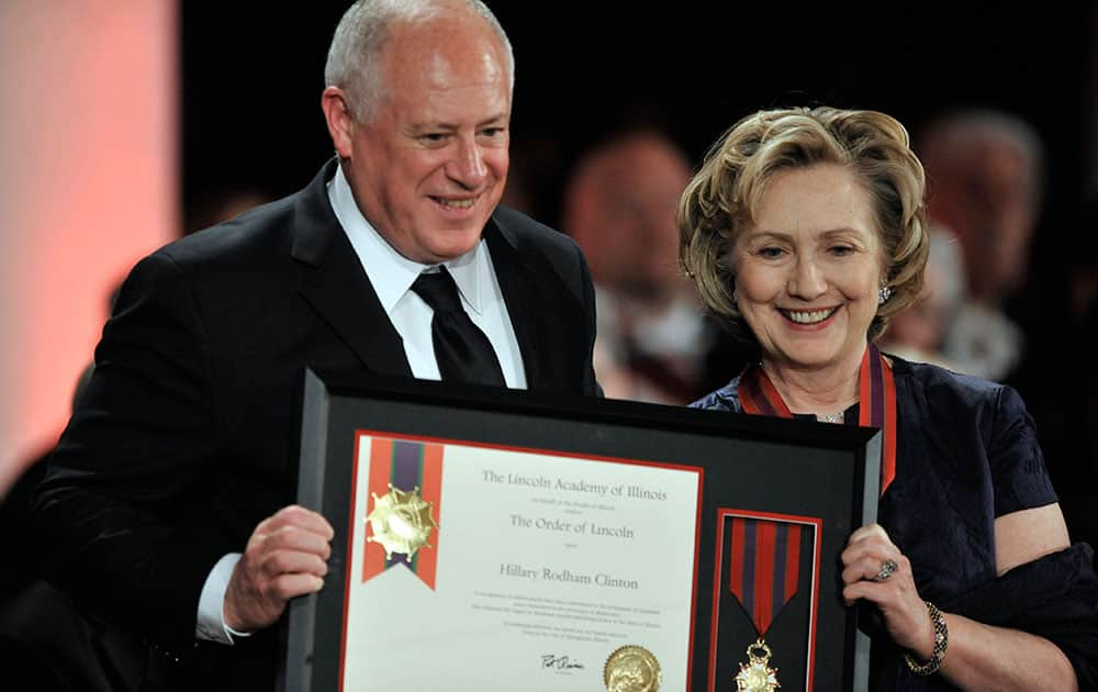 Hillary Rodham Clinton is presented the Order of Lincoln Award by Illinois Gov. Pat Quinn at the Field Museum in Chicago.