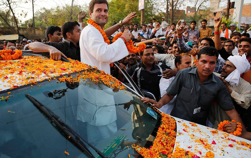 Congress party Vice President Rahul Gandhi greets supporters during an election campaign rally in Amethi, in the northern Indian state of Uttar Pradesh.