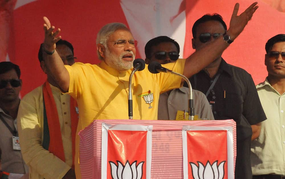 BJP PM candidate Narendra Modi addresses an election campaign rally in Roorkee.