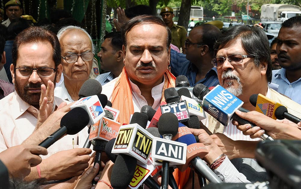 BJP leaders Ananth Kumar, Mukhtar Abbas Naqvi and Chandan Mitra talking to media after meeting with CEC at Election Commission office in New Delhi.