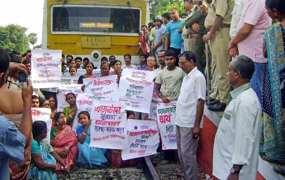 Saradha Chit Fund investors and agents stop a train at Chadpara Railway Station in North 24 Pargana district, West Bengal.