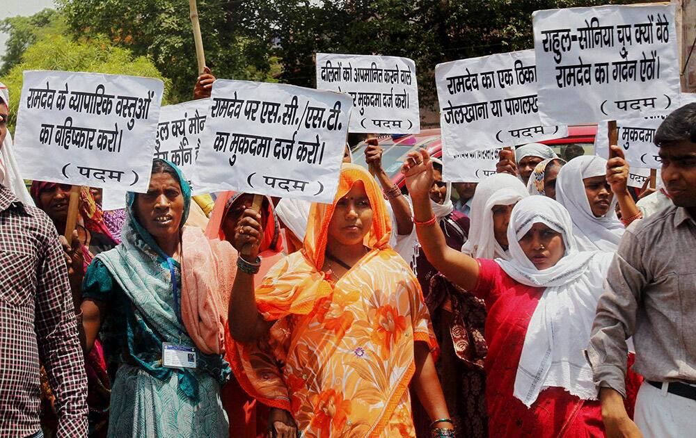 Dalit community members protest against Yoga guru Ramdev in Allahabad.