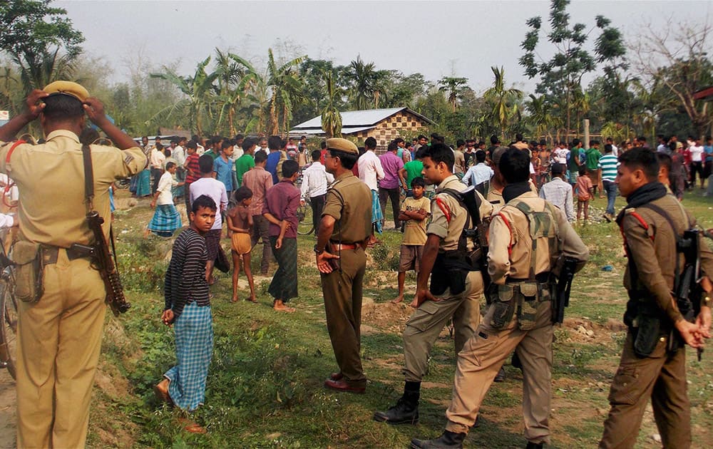 Security personnel at Narsingbari where some people were killed by militants in Baksa district of Assam.