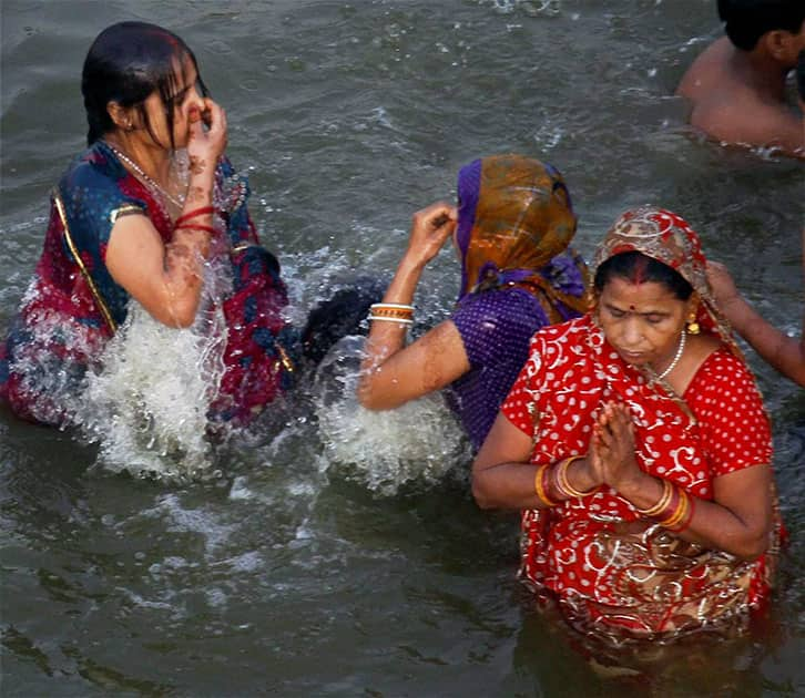 Hindu women devotees take holy dip in the river Ganga on the occasion of Akshaya Tritiya festival in Allahabad.