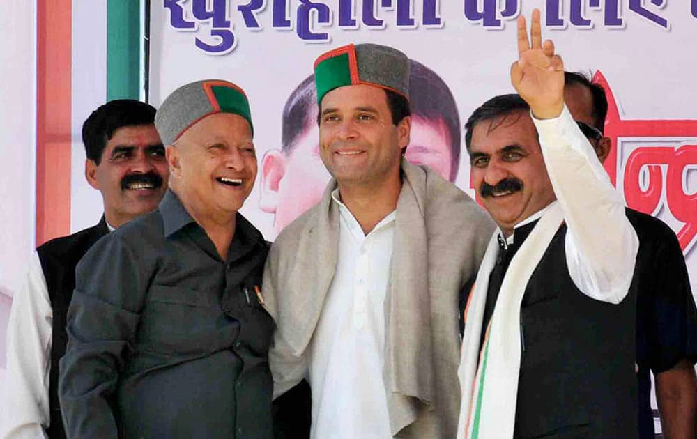 Congress Vice President Rahul Gandhi with Himachal Pradesh Chief Minister Virbhadra Singh and party candidate from Hamirpur Rajinder Rana during an election rally in Bilaspur, Himachal Pradesh.