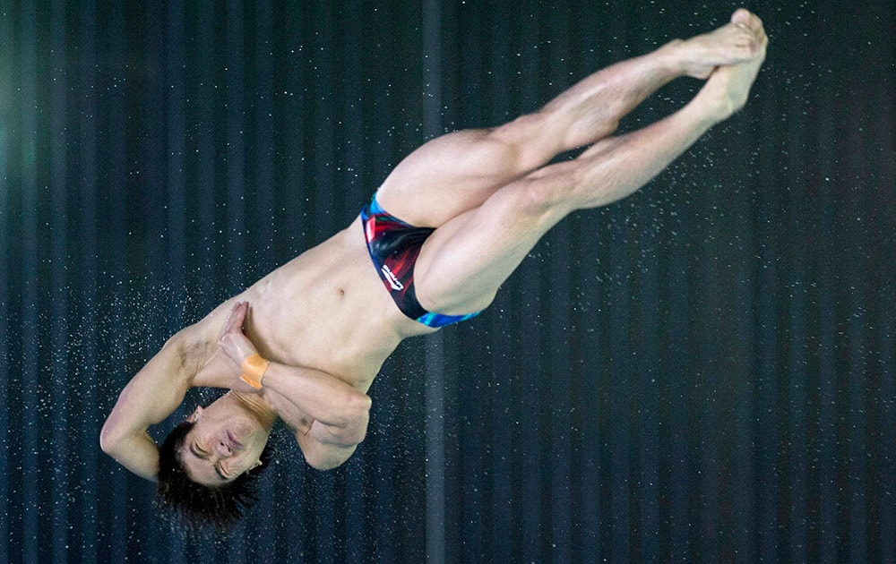 China`s Huo Liang competes in the men`s 10-meter platform preliminary event at the FINA diving grand prix at the Gatineau Sports Complex in Gatineau, Quebec.