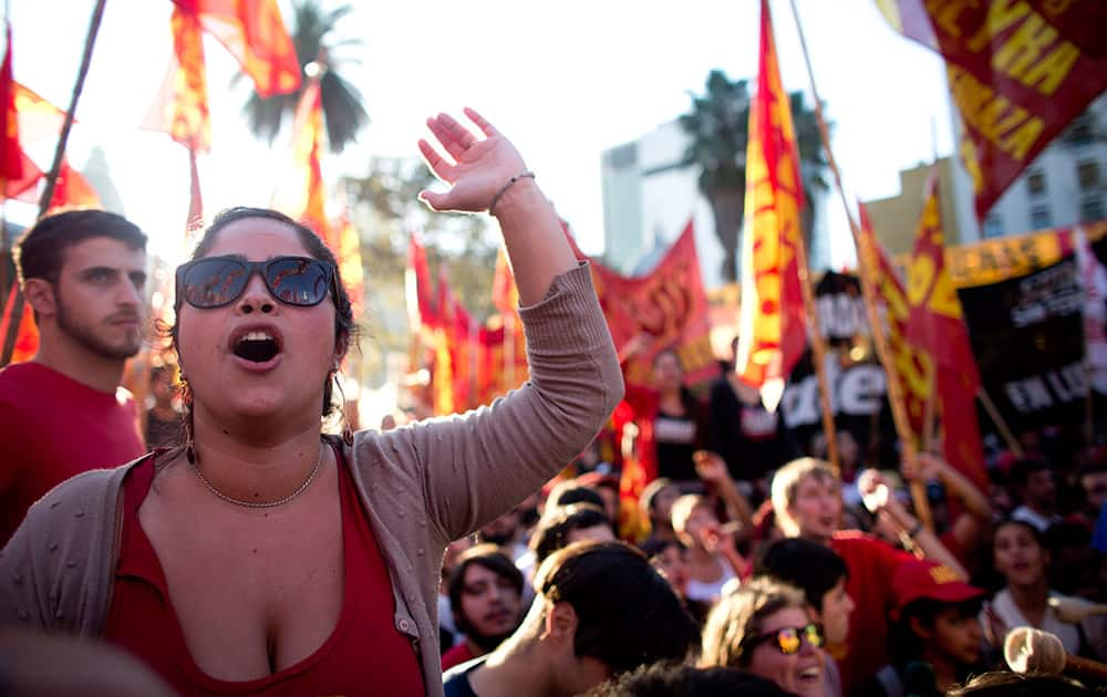 Activists shout slogans during a Workers Day march in Buenos Aires, Argentina.