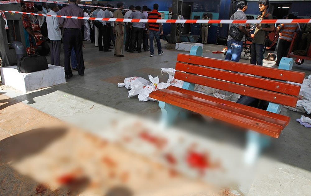 Blood lies splattered at a railway platform close to a passenger train that was ripped by two blasts at the railway station in Chennai. Twin blasts ripped through two coaches of the train Thursday morning just minutes after it pulled into Chennai railway station, one of India`s busiest train stations, killing a 22-year-old woman and injuring 14 people, officials said.