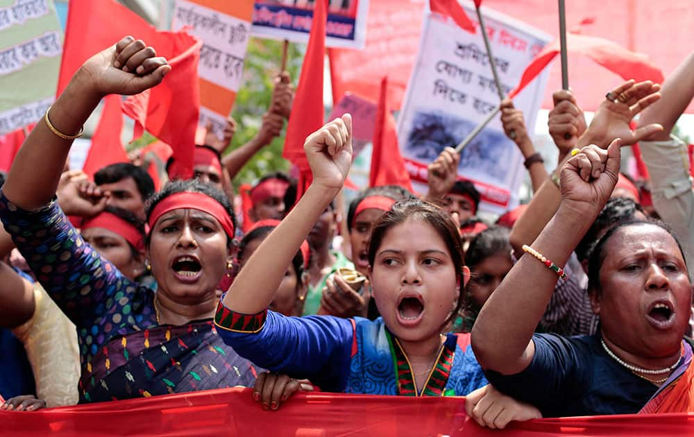 Bangladeshi garment workers and activists shout slogans demanding punishment for owners of garment factories that have had accidents in the past, compensation for victims and ensuring work place safety during a May Day rally in Dhaka, Bangladesh.