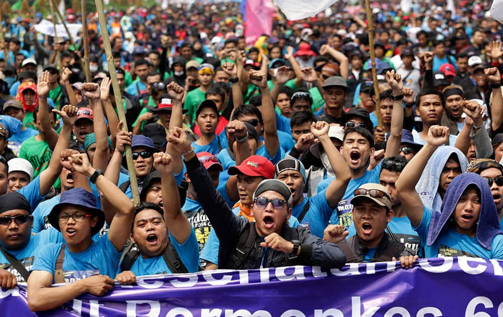 Indonesian workers shout slogans during a May Day rally in Jakarta, Indonesia.